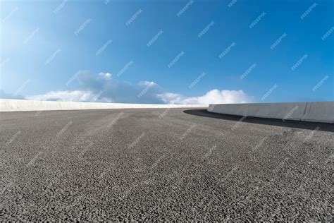 Premium Photo Skyline Of Asphalt Pavement And Blue Sky And White Cloud