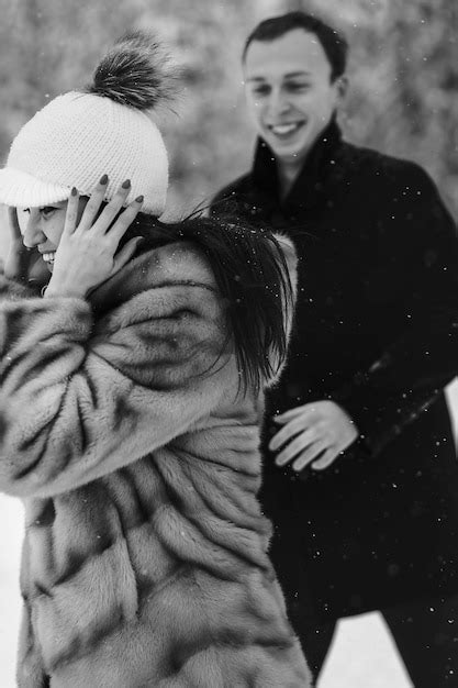 Premium Photo Stylish Couple In Love Having Fun In Snowy Mountains