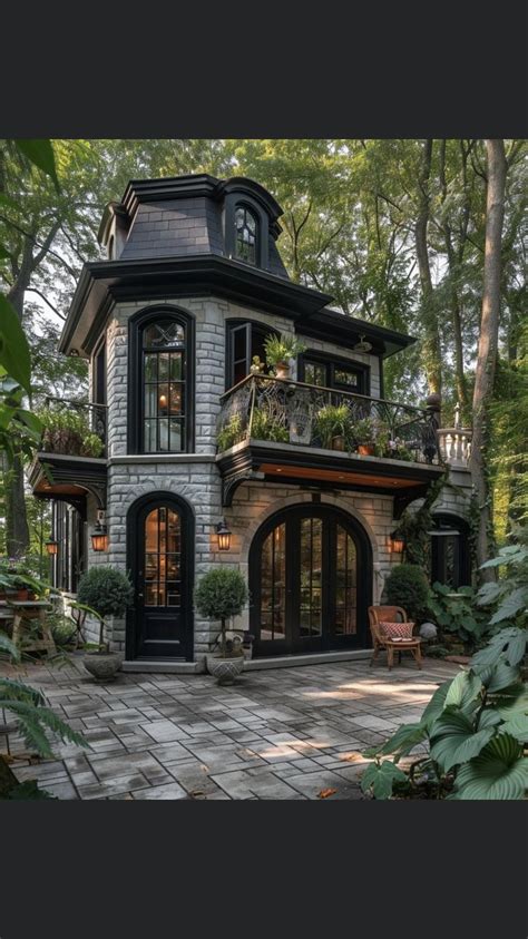 A Very Nice Looking House In The Middle Of Some Trees And Plants On Top