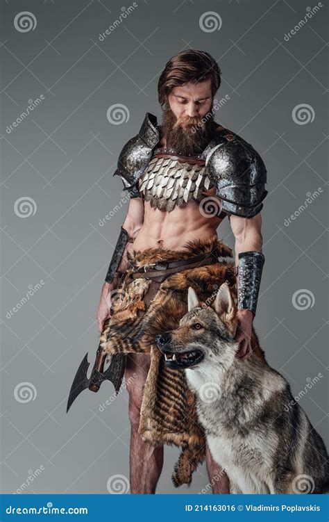 Legendary Viking With Muscular And Naked Body Posing With His Wolf