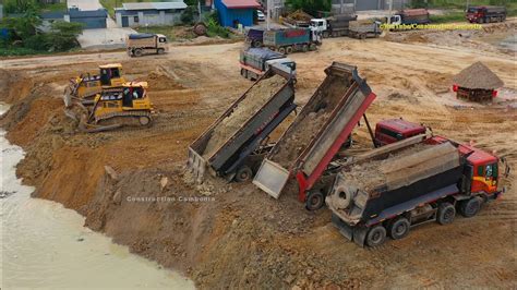 Hyundai Scania Dump Trucks Unloading Soil Shantui Bulldozer Pushing