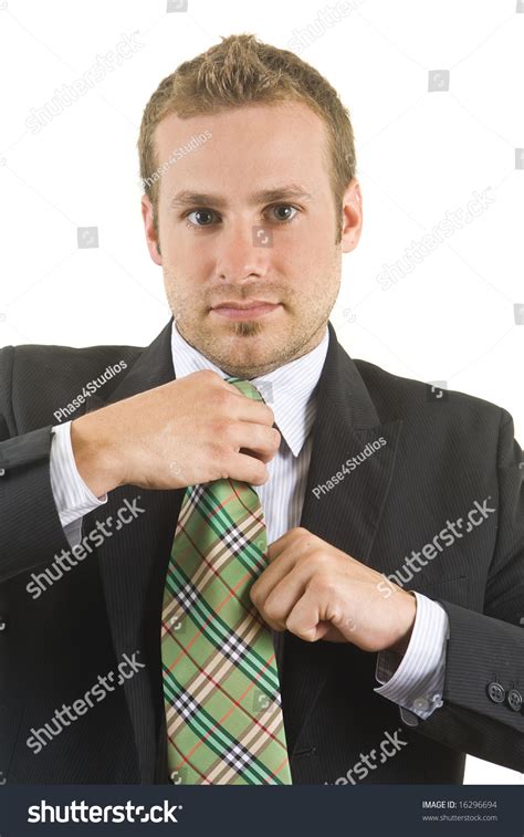 Handsome Business Man Adjusting His Tie Stock Photo 16296694 Shutterstock