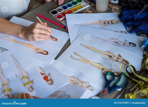 Faceless Woman Draws Sketches Of Swimwear Close Up Of The Hands Of A