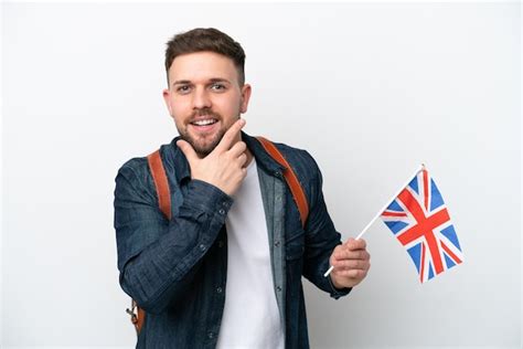 Jovem Homem Caucasiano Segurando Uma Bandeira Do Reino Unido Isolada Em