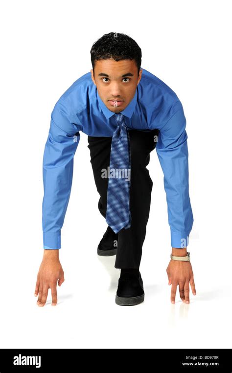 Portrait Of Young Businessman At The Starting Line Isolated Over White