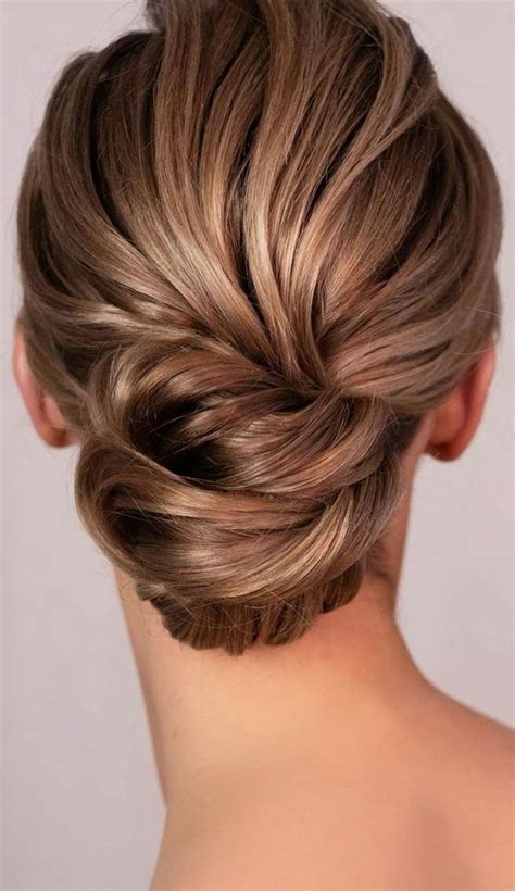 Amazing Ways To Style An Updo In Voluminous Low Bun Brown Hair