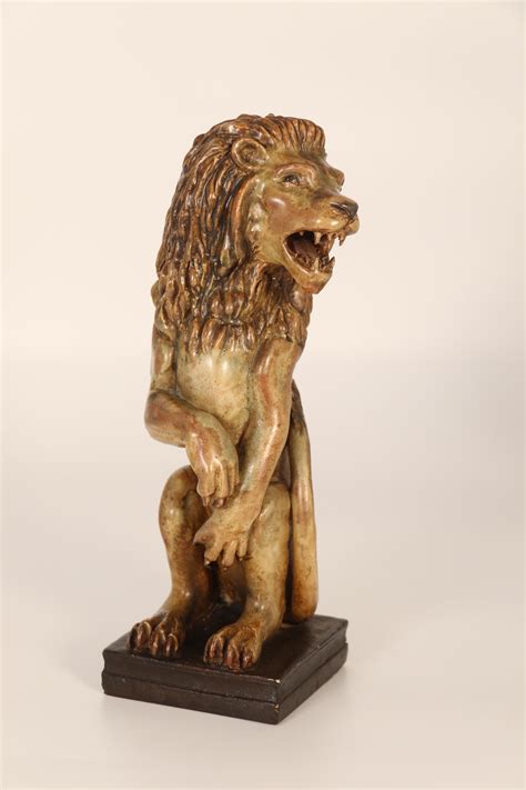 A Pair Of Art Pottery Hand Sculpted Figures Of A Heraldic Lion And