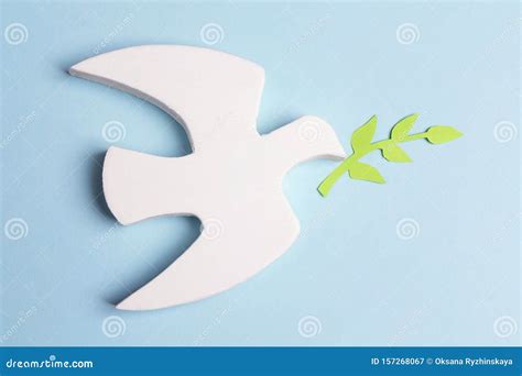 Dove Of Peace With Olive Branches On A Blue Background Stock Image