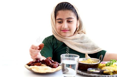 Adorable Happy Smiling Muslim Girl With Beautiful Eyes Wearing Traditional Hijab Sitting At