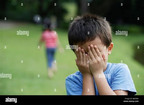 kids playing hide-and-seek Stock Photo - Alamy