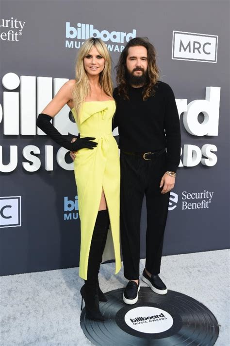 Heidi Klum Pops in Yellow Dress and Sharp Thigh-High Boots on Billboard ...