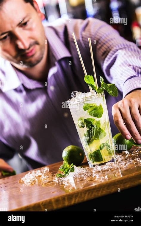 Mojitobartender In Night Pub Preparing Alcoholic Drink Mojito Stock