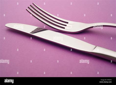 Knife And Fork Detail Over A Purple Background Cutlery Horizontal