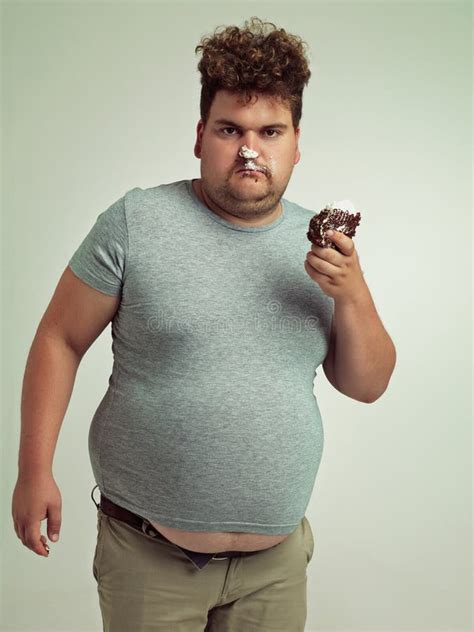 What This Is How You Eat Cake An Overweight Man Messily Eating A Slice