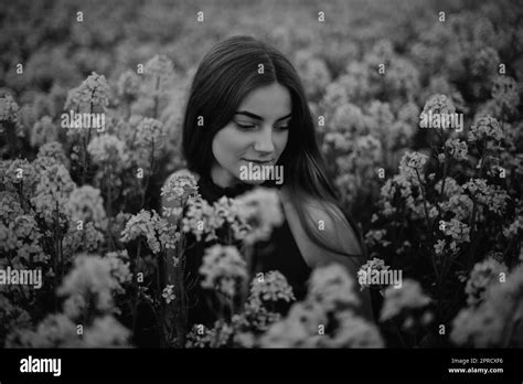Girl In The Flower Field Stock Photo Alamy