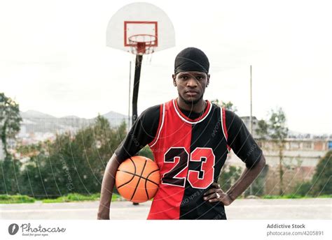 Black male basketball players shaking hands on court - a Royalty Free ...