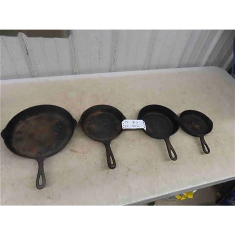 4 Cast Iron Frying Pans - McSherry Auction Service Ltd.