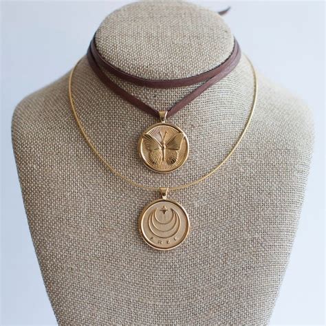 7 Meaningful Gold Pendant Necklaces You Need Around Your Neck Brit Co