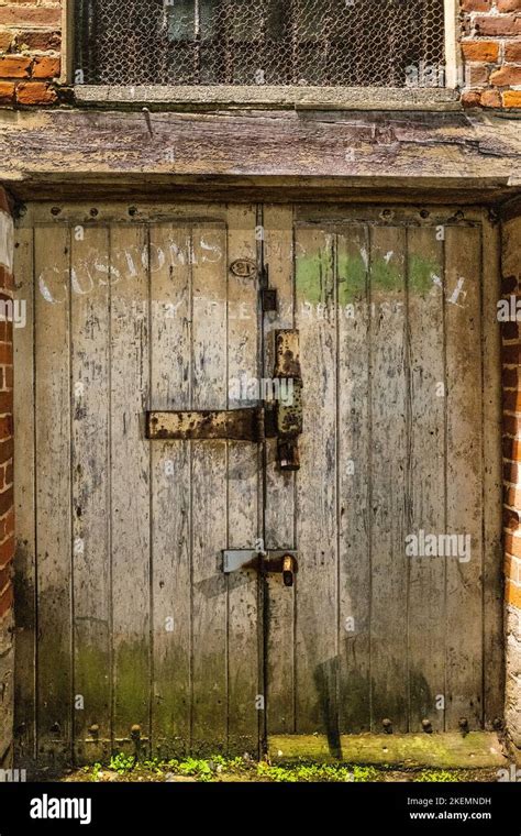 Weathered Wooden Customs Warehouse Door In Bridport Dorset With Rusty