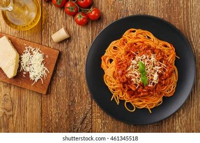 Delicious Spaghetti Tomato Sauce Served On Black Plate Royalty Free