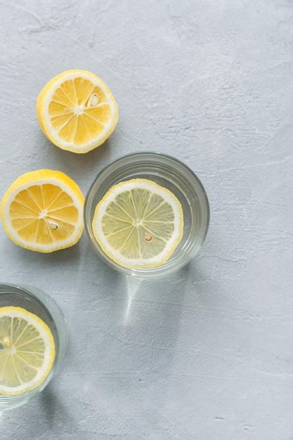 Premium Photo Two Glasses Of Water With Lemon Slices Lemon Citrus