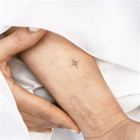 Minimalist Tattoo Of A North Star Located On The Inner