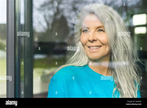 Happy Mature Woman By The Window Hi Res Stock Photography And Images Alamy
