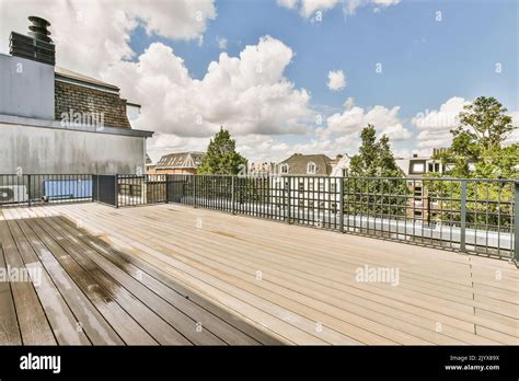 Bright Wooden Balcony With Metal Railings And Door Stock Photo Alamy