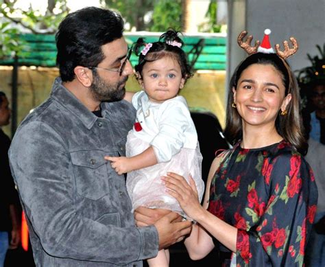 Actors Ranbir Kapoor and Alia Bhatt with their daughter Raha