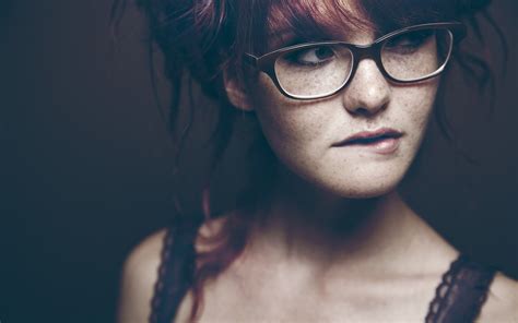 Woman In Black Top Wearing Glasses Against Black Background Hd