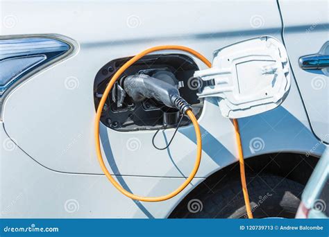 Electric Hybrid Plug In Car At Charging Station Editorial Stock Photo