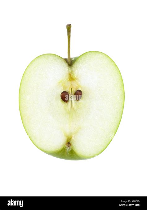 Green Apple Sliced In Half On White Background Stock Photo Alamy