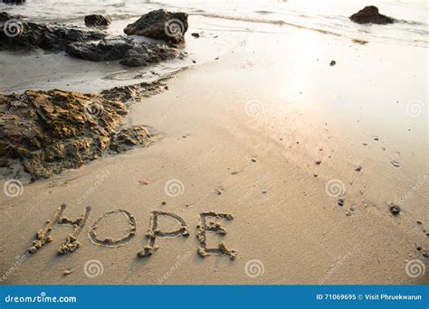 Hope Written In The Sand At The Beach Waves In The Background Stock