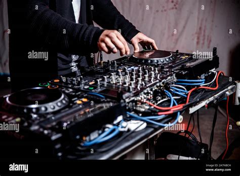 DJ Plays Live Set And Mixing Music On Turntable Console At Stage In The