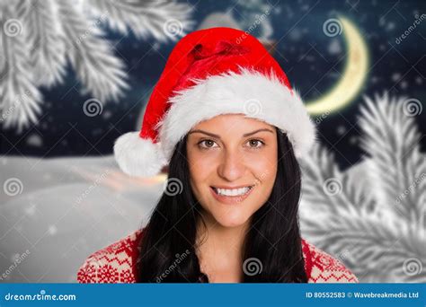 Portrait Of Beautiful Woman In Santa Hat Smiling At Camera Stock Image