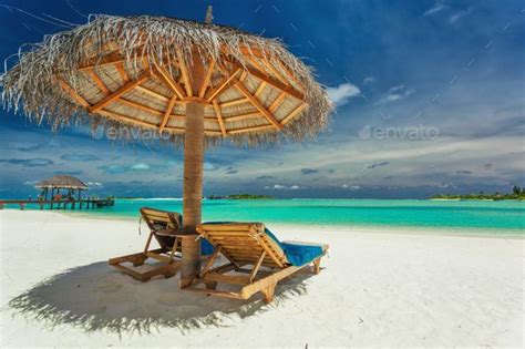 Two Chairs And Umbrella On Stunning Tropical Beach Maldives By