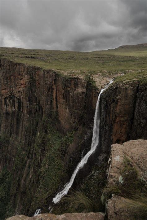 A Large Waterfall In The Middle Of A Cliff