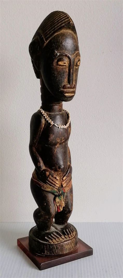 An African Carved Tribal Wood Figurine Cm On A Later Base And A