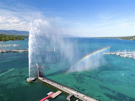 Geneva water fountain with rainbow Photograph by Andrea Aliotti