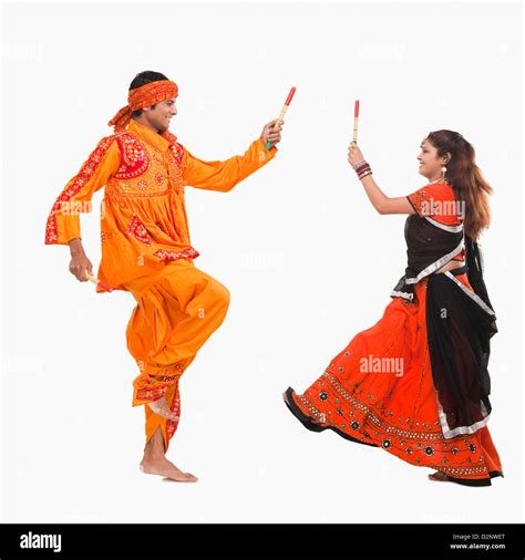 Couple Performing Dandiya Stock Photo Alamy