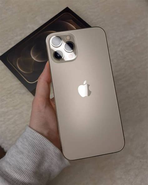 Someone Holding An Iphone In Their Hand With The Camera On It S Left Side