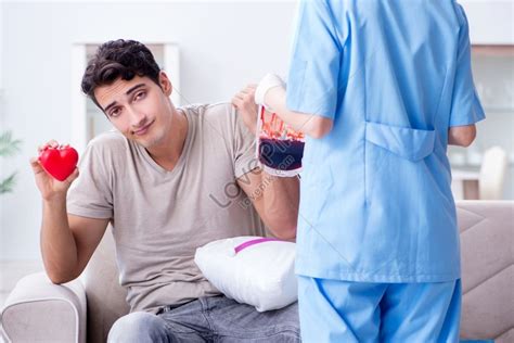 Patient Receiving Blood Transfusion In Hospital Clinic Photo Picture