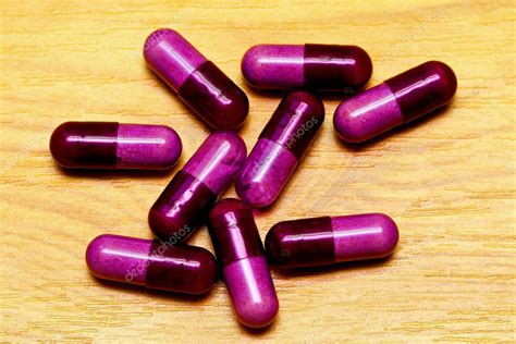 Purple pills — Stock Photo © Baloncici #3543592