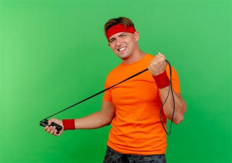 Free Photo Confident Young Handsome Sporty Man Wearing Headband And