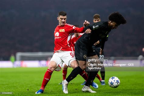 Robin Gosens of Union Berlin tackles Jens Cajuste of Napoli during ...