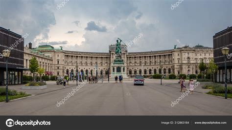 Public square and gardens in front of the old imperial Hofburg Palace, with imposing statues ...