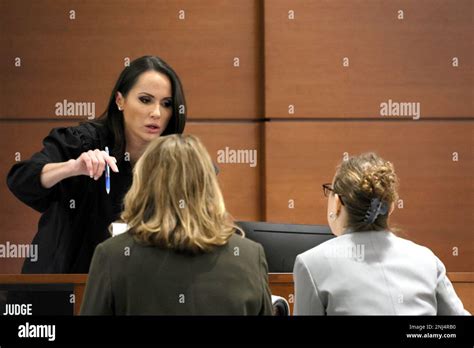 Judge Elizabeth Scherer Speaks With Assistant State Attorney Carolyn