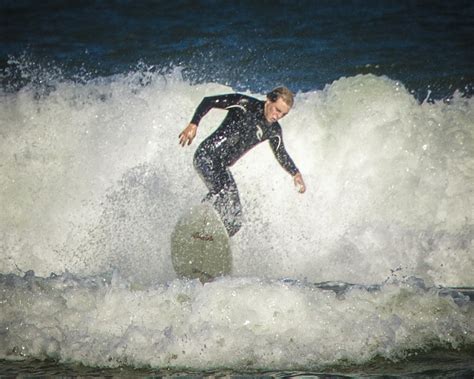 Surfer Playing In Waves Below Ponce Inlet 3 Photograph By Don Harper