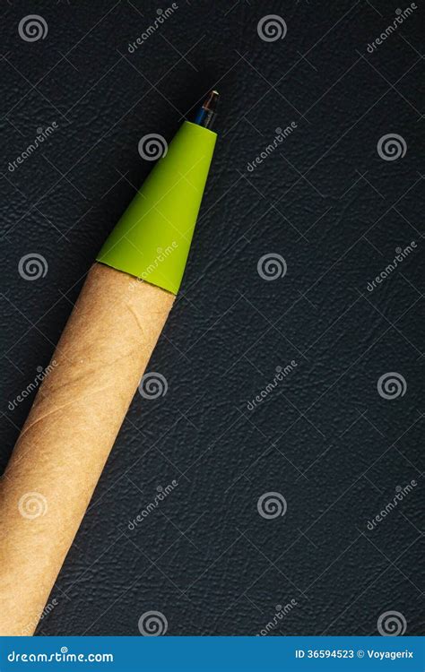 Green Pen Writing Material On Black Leather Background Stock Image