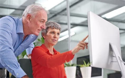 Sharing Her Ideas With A Colleague Two Mature Business Colleagues